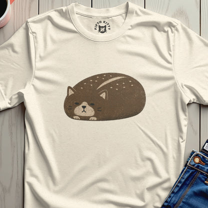 Cream t-shirt with graphic of a brown, speckled cat loaf and "FIFTH KITTY" neck label.