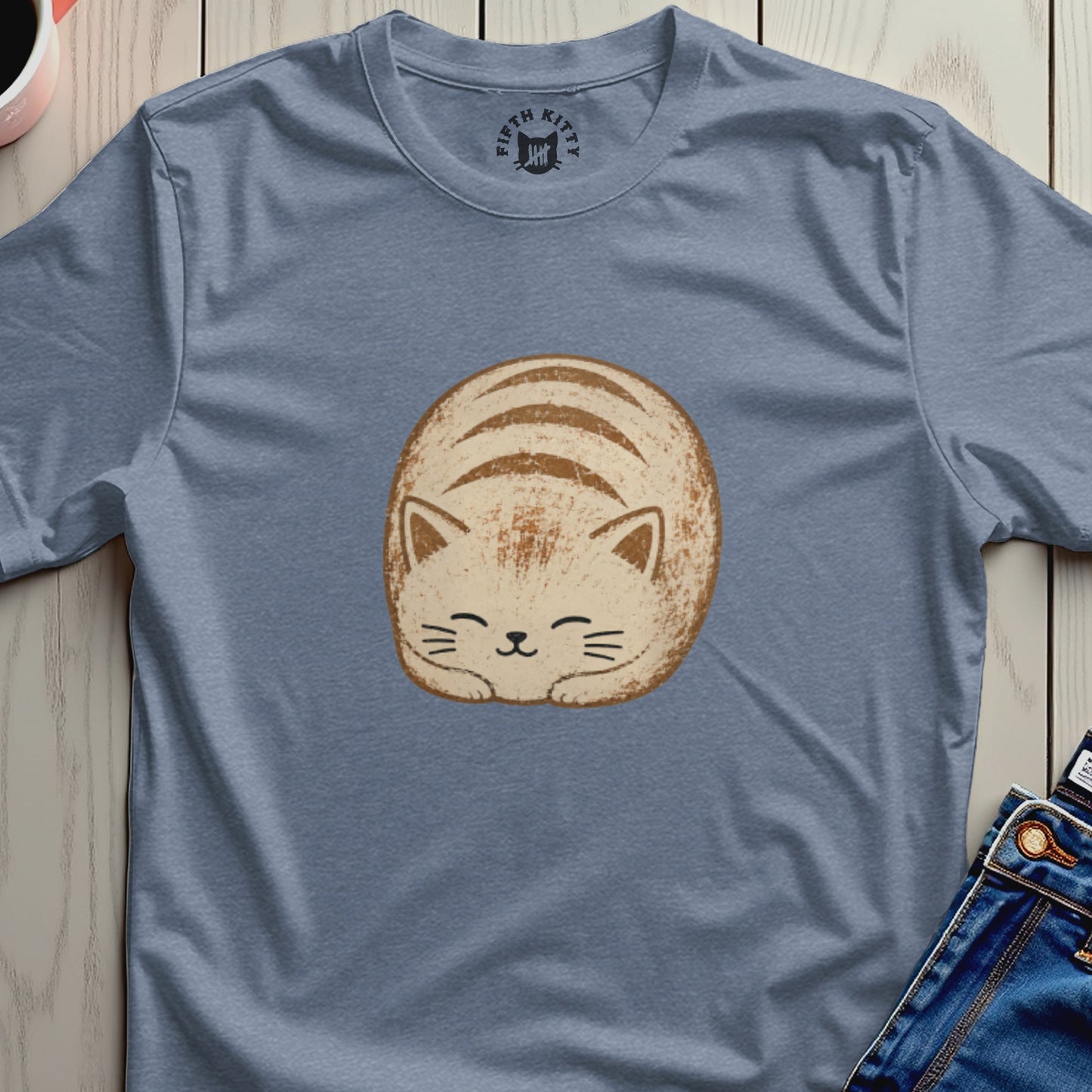 Cute loaf cat illustration on a blue t-shirt with "FIFTH KITTY" logo.