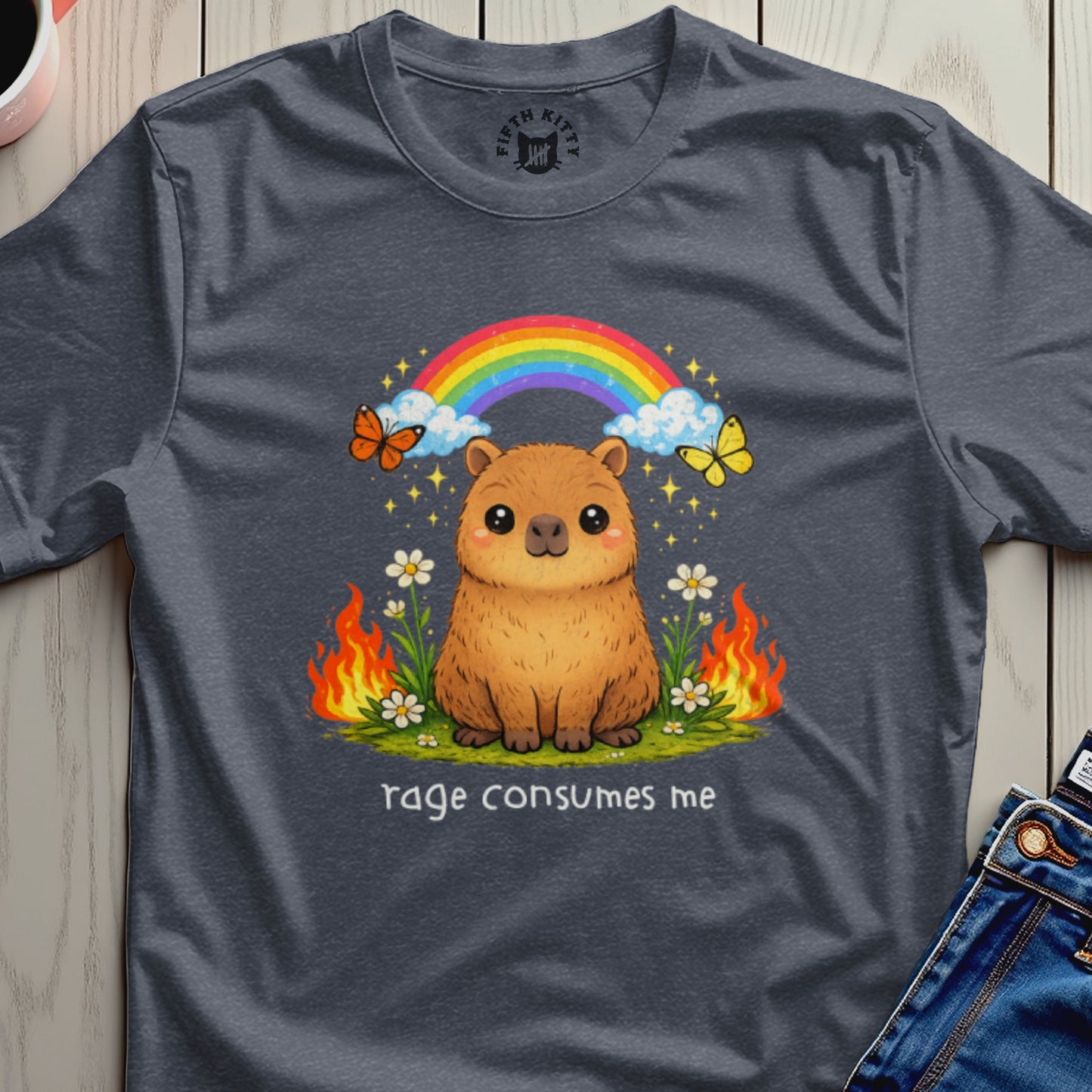 Capybara with rainbow, butterflies, and flames, text "rage consumes me".