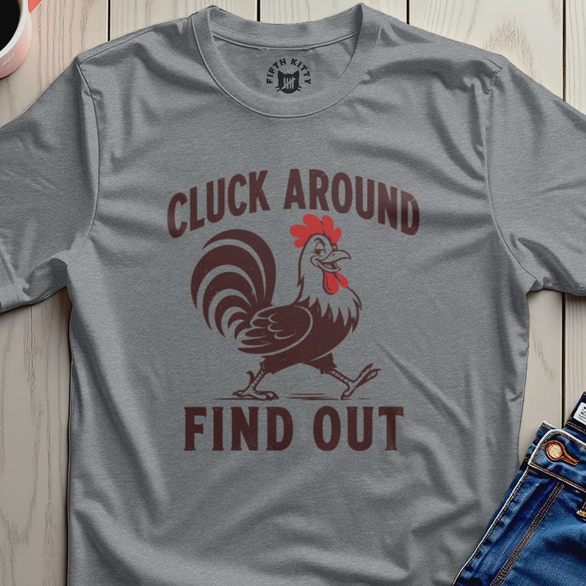 Gray t-shirt with a rooster graphic and the text "CLUCK AROUND FIND OUT".