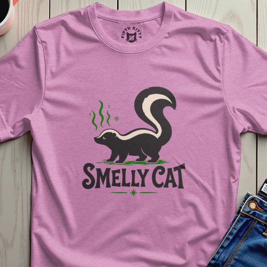 Pink t-shirt with a skunk graphic and text "SMELLY CAT"