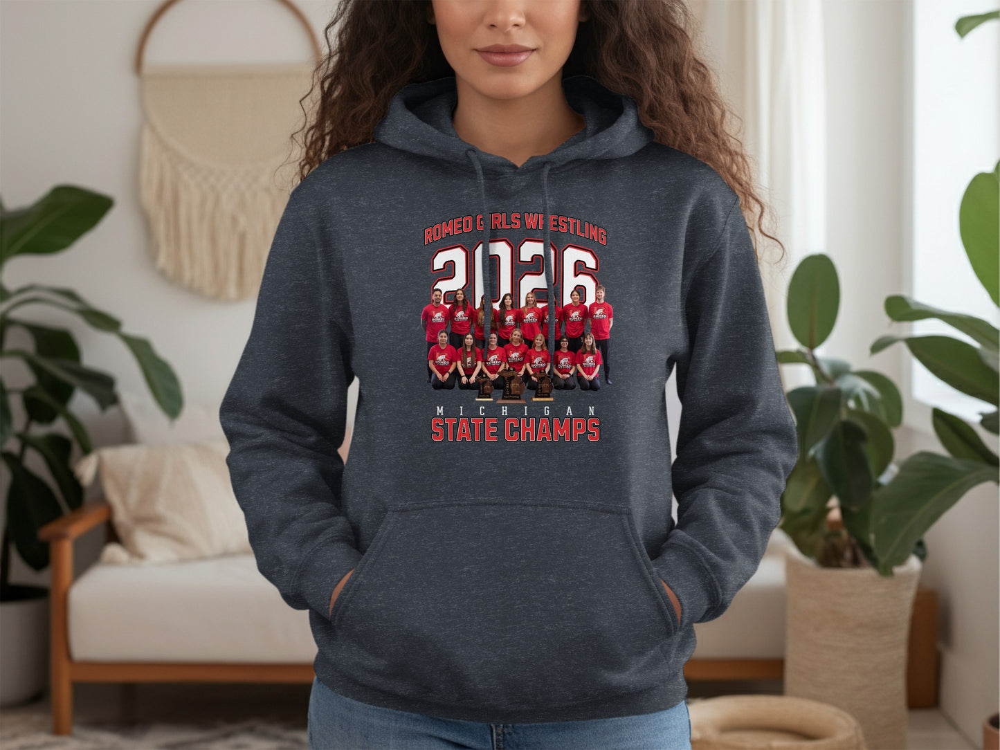 Dark gray hoodie with "Romeo Girls Wrestling 2026 Michigan State Champs" and team photo.