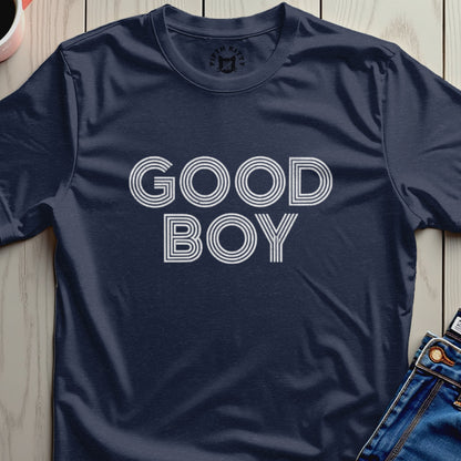 Navy t-shirt with white "GOOD BOY" text, folded over jeans.