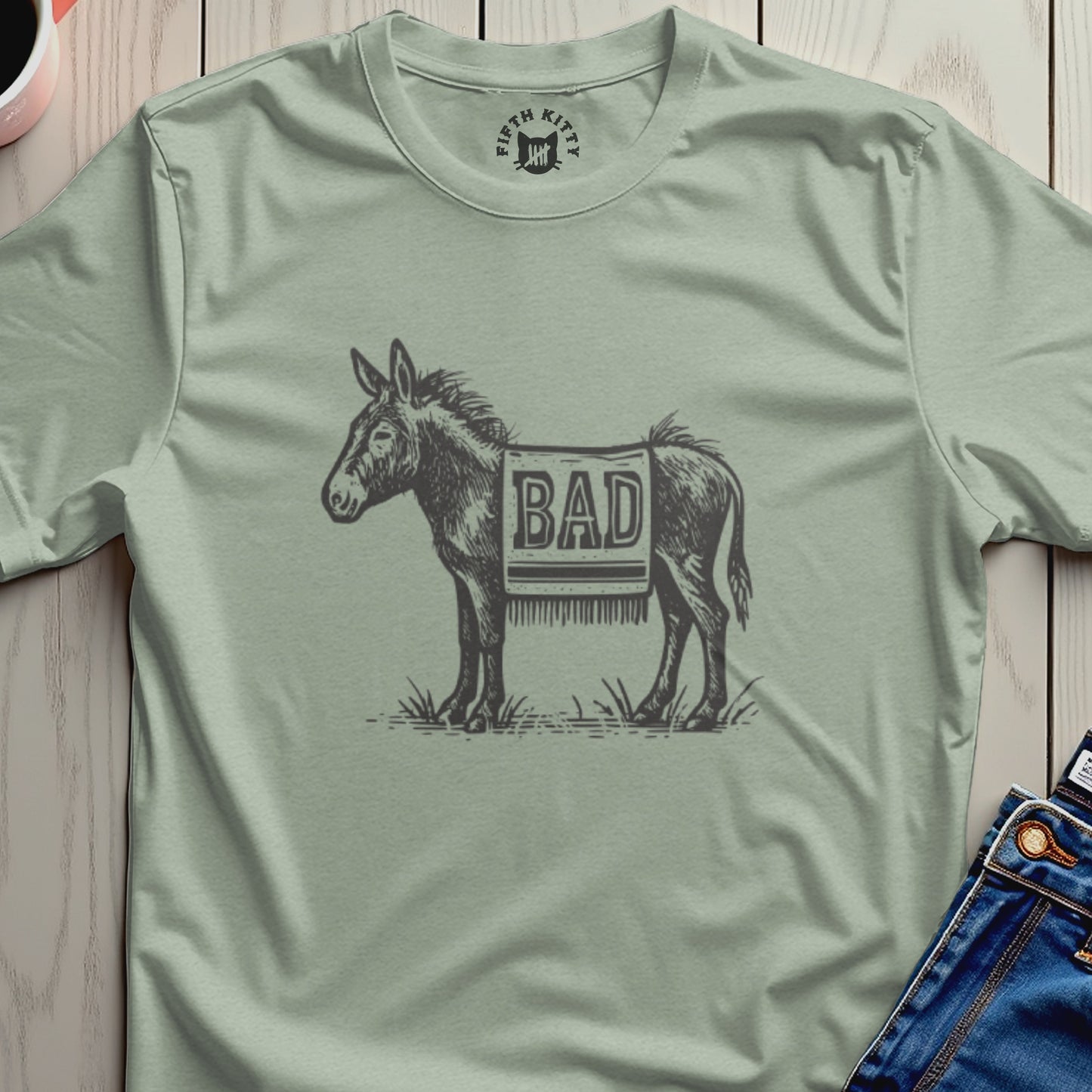 Donkey wearing a blanket with "BAD" printed on it.