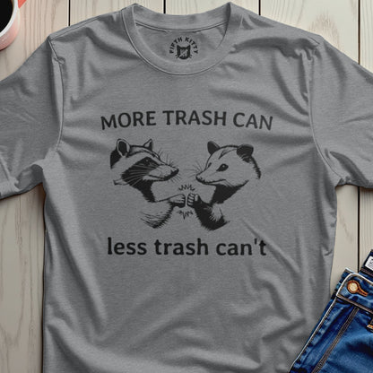 Grey t-shirt with graphic of raccoon and possum fist-bumping, saying "More trash can, less trash can't".