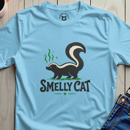Light blue t-shirt with a skunk graphic and "SMELLY CAT" text.